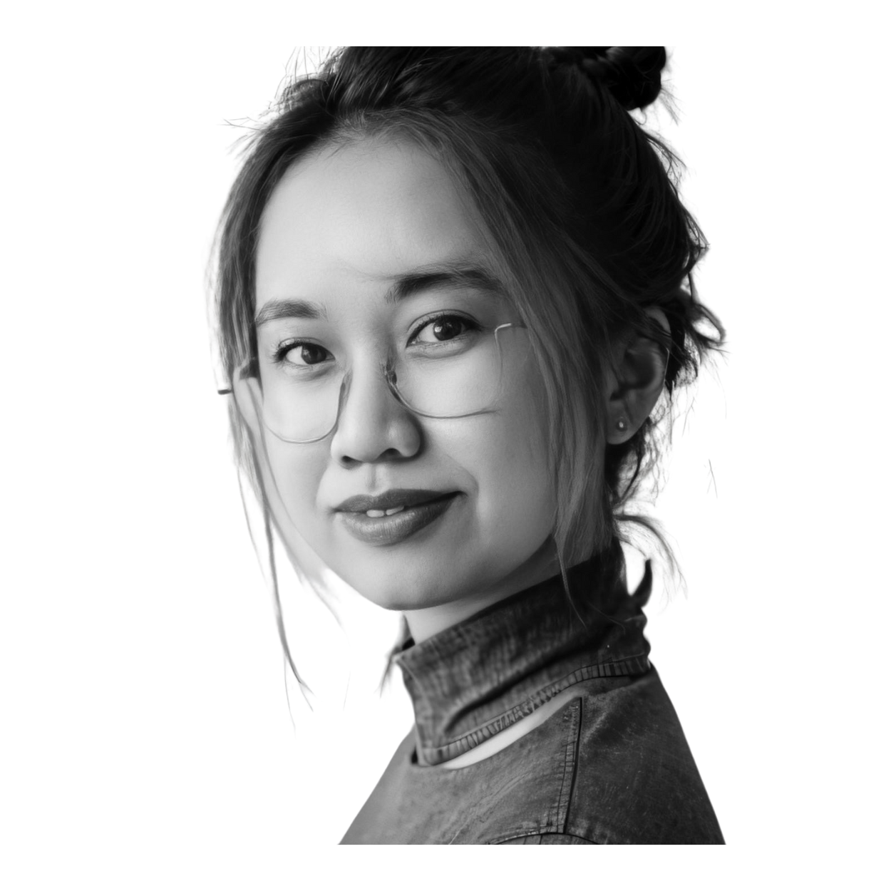 A professional headshot of Vania, featuring a confident and approachable expression. It is black and white, with well-balanced lighting highlighting facial features. Dressed in professional attire, the image conveys a polished and modern look suitable for a portfolio profile.